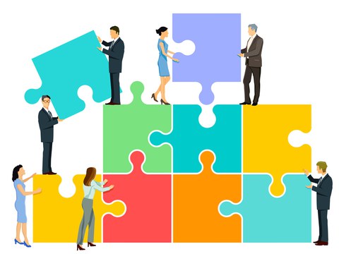 Berufsleute fügen Puzzleteile zusammen. Bild © panthermedia.net / Norbert Buchholz